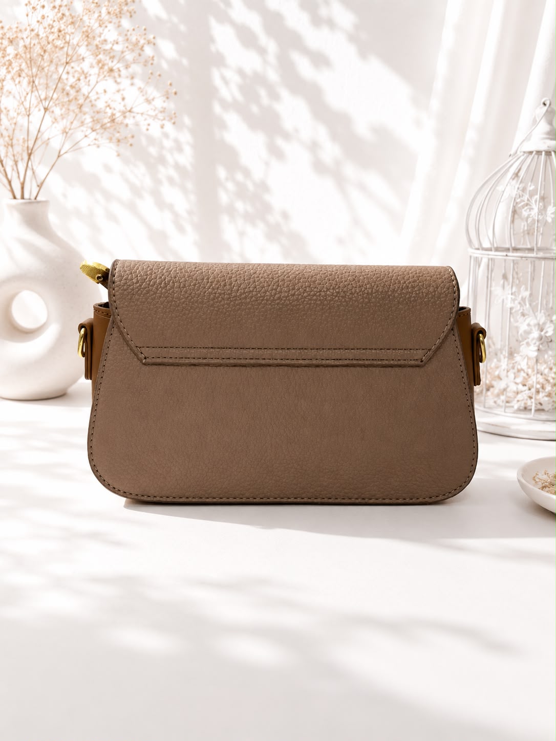 Pebbled Buckle-Strap Saddle Bag