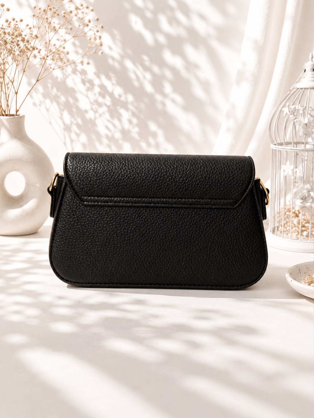 Pebbled Buckle-Strap Saddle Bag