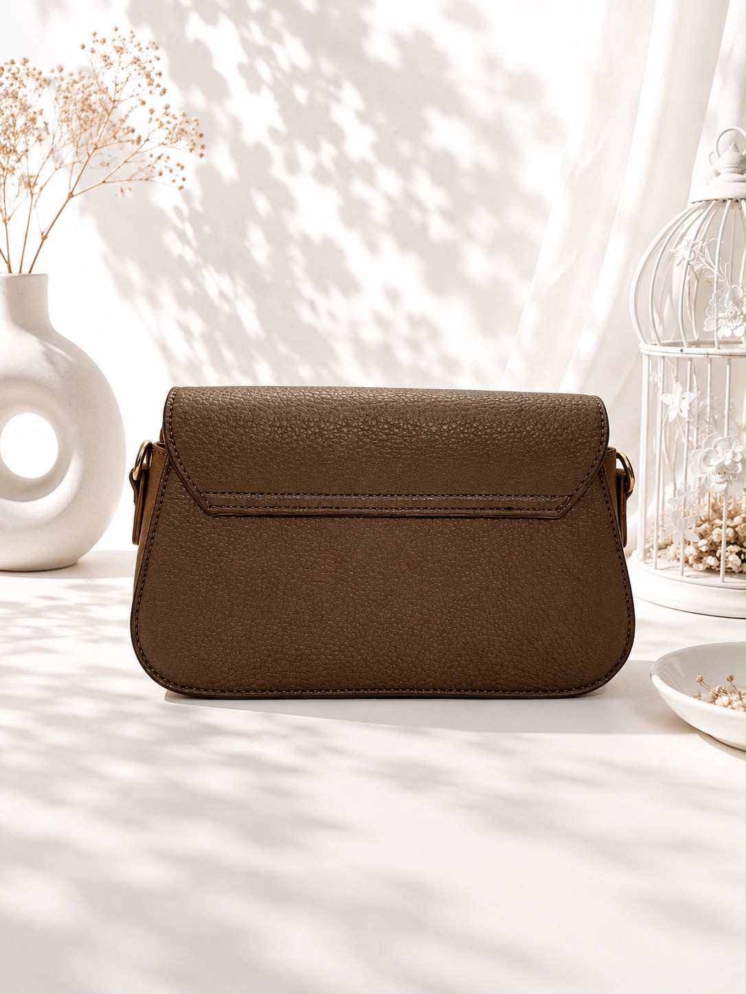 Pebbled Buckle-Strap Saddle Bag