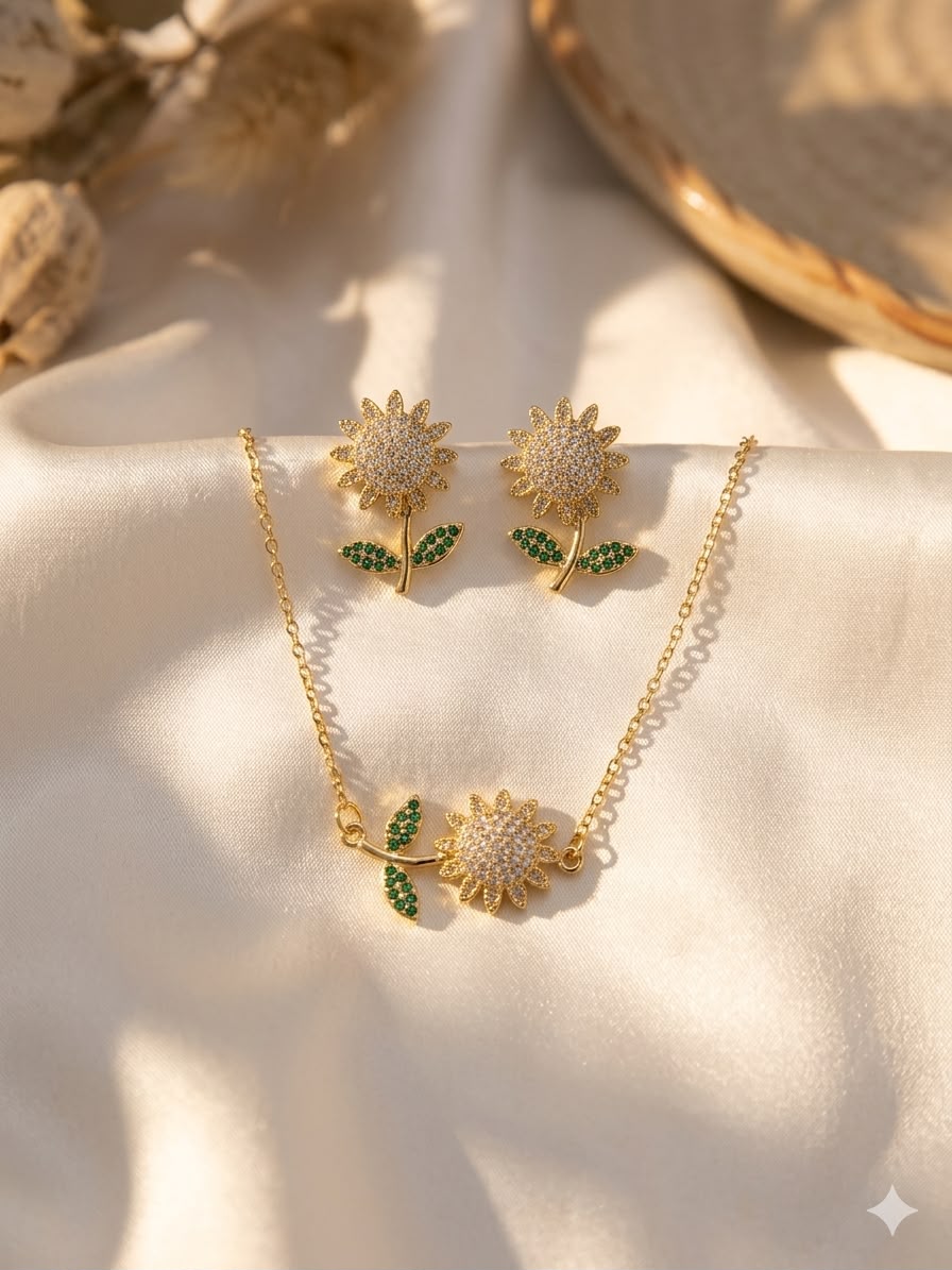 Sunflower pendant necklace and stud earrings set in gold tone with green leaf accents