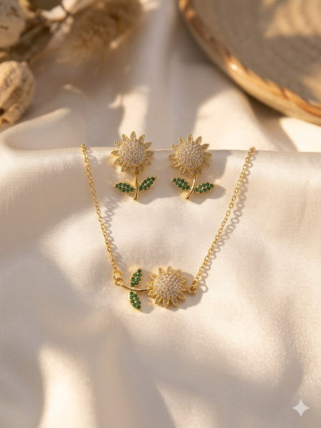Sunflower pendant necklace and stud earrings set in gold tone with green leaf accents