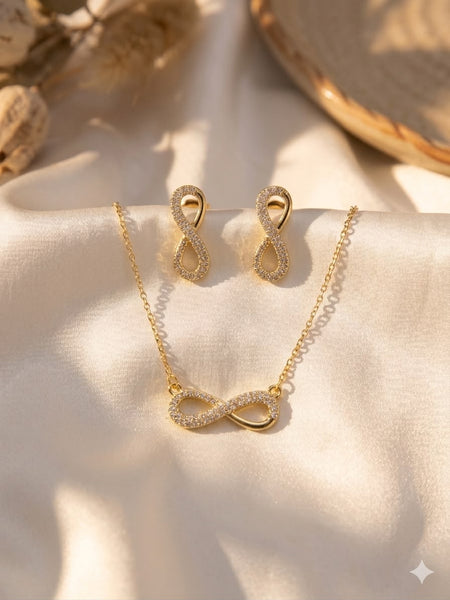 Infinity CZ pendant necklace and stud earrings set in gold tone