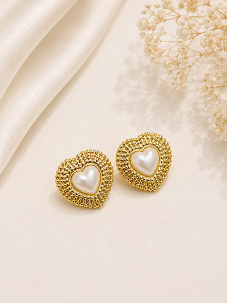 Gold beaded frame pearl heart stud earrings flat lay