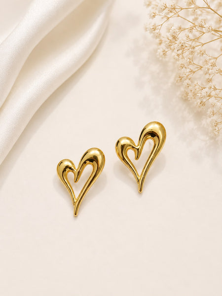 Gold open heart stud earrings flat lay