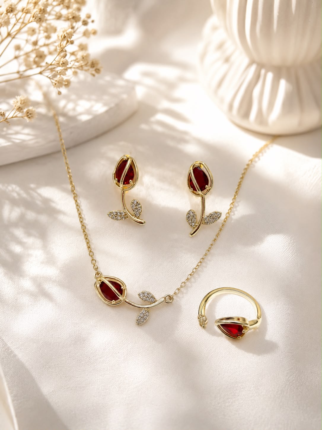 Ruby Rosebud Jewelry Set - flat lay with necklace, earrings and ring