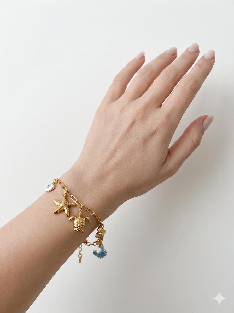Sea Turtle Charm Bracelet - gold chain with turtle, starfish, evil eye and wave charms