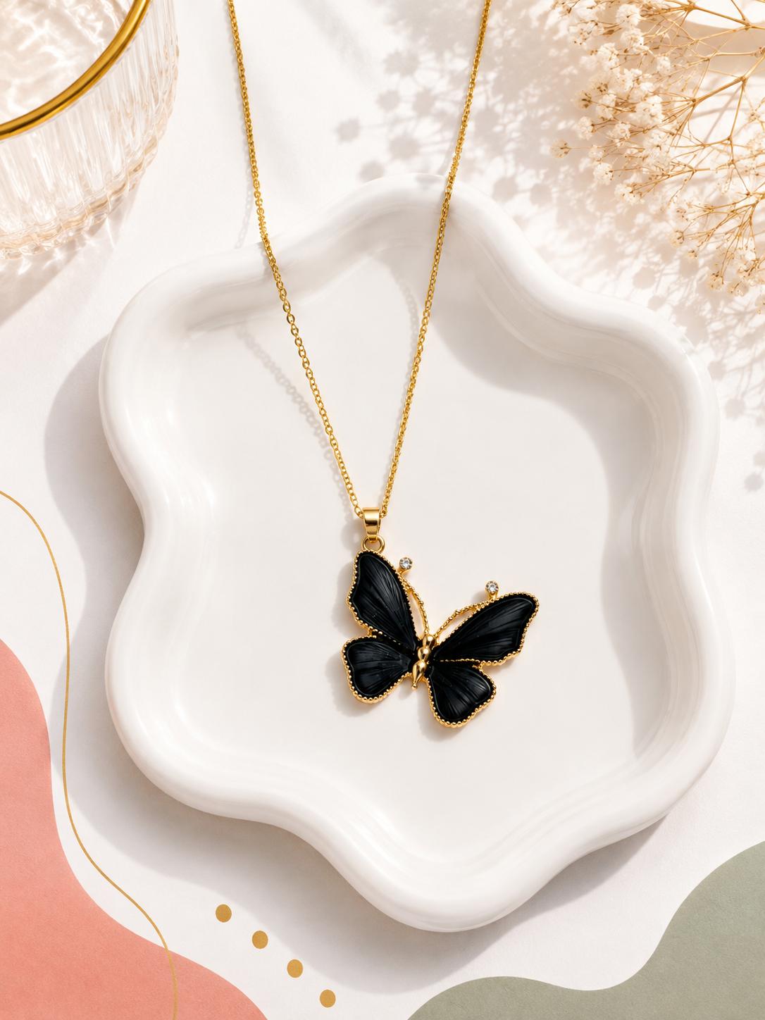 White butterfly necklace on model