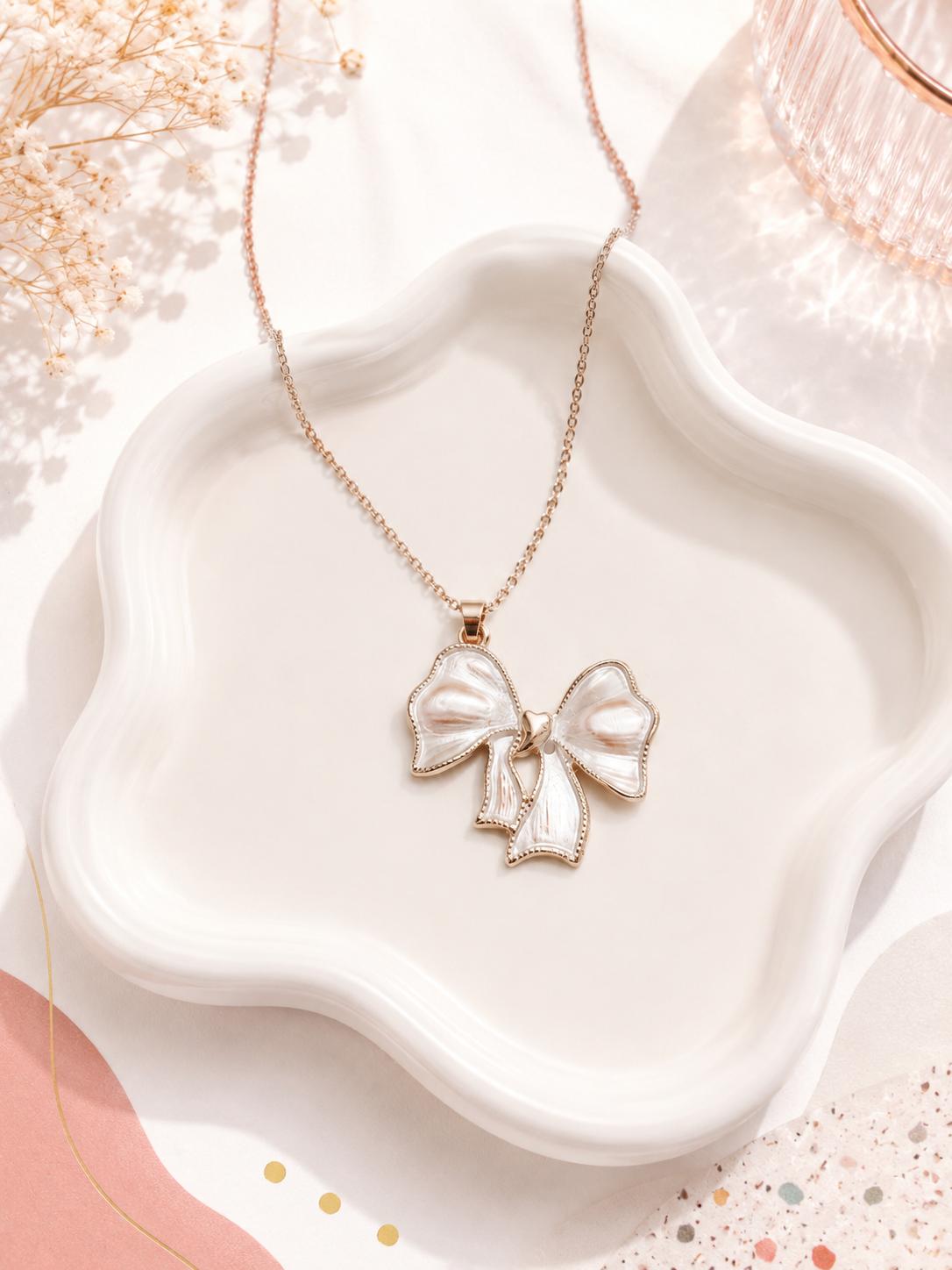 Black butterfly necklace on model