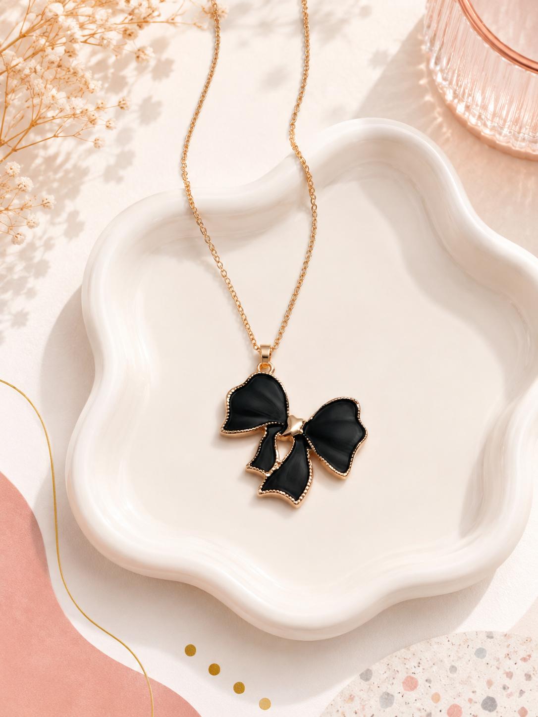 White bow necklace on model