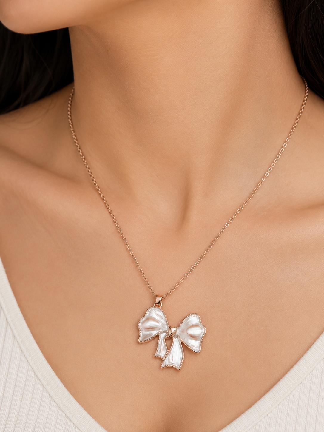 White butterfly necklace flat lay