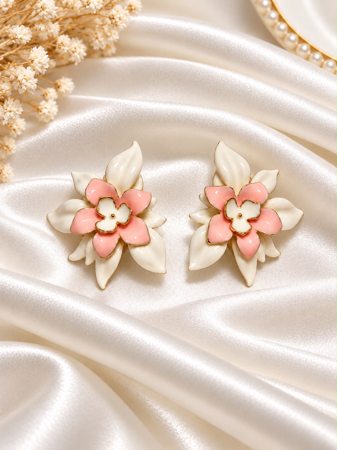 Pink and ivory floral earrings with layered petals and gold-tone accents