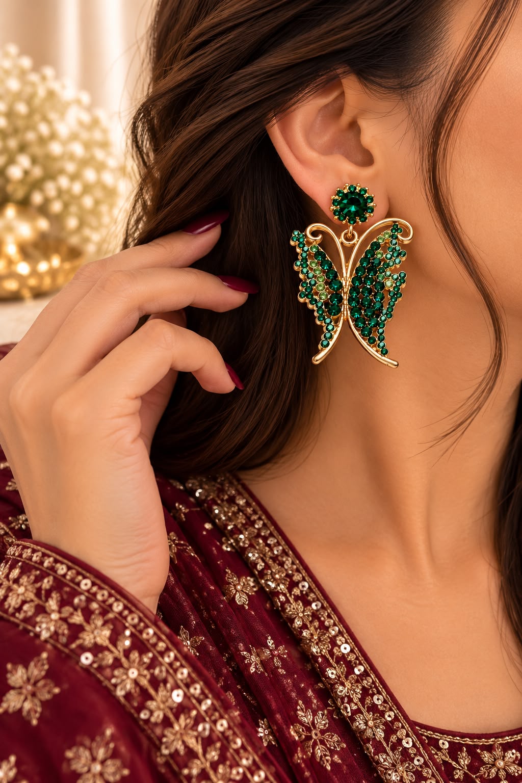 Model wearing green butterfly statement earrings