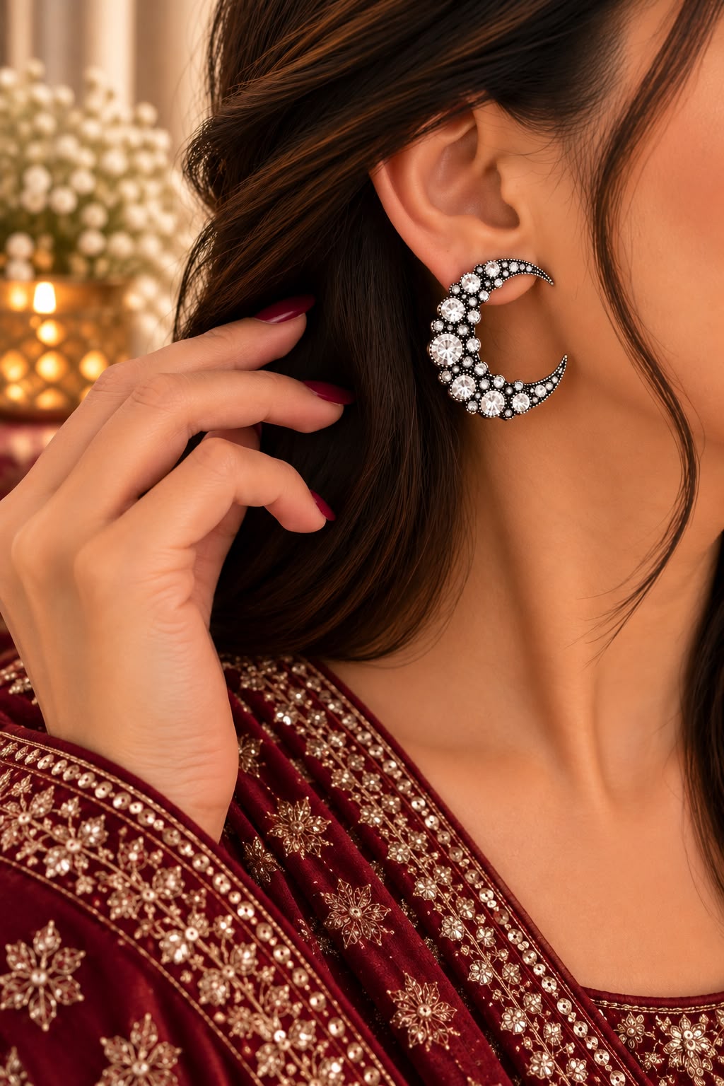 Model wearing crystal crescent statement earrings