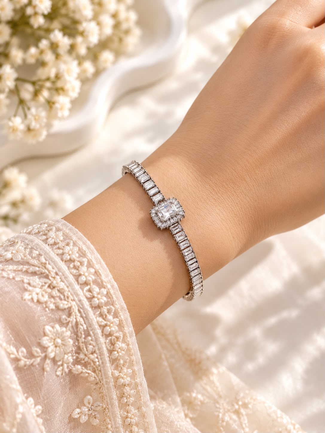 Regalia silver-tone rectangular halo bracelet with clear stones worn on a wrist